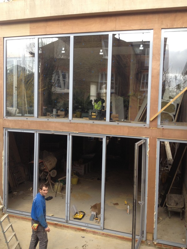 Aluminium bi-fold doors with two-storey glazing in Berkhamsted