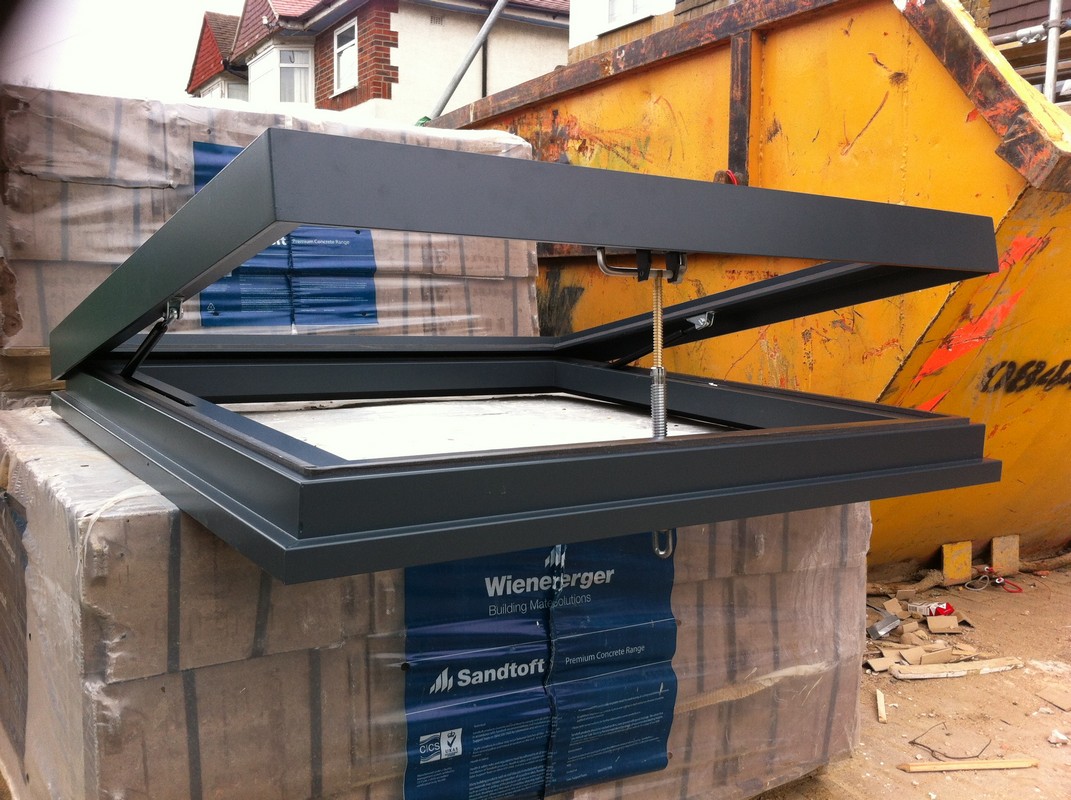 Opening flat roof skylight in anthracite grey installed in Berkhamsted